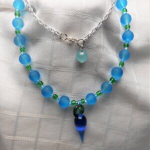 No 1075 Handmade necklace with torch-worked glass pieces shaped like a pepper